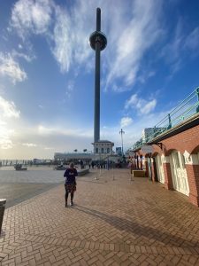 A tall tower with viewing platform viewed against a blue sky